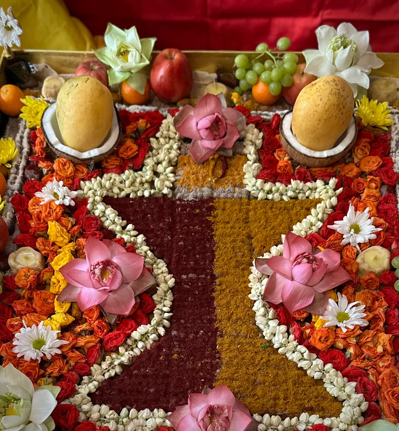 An elaborate floral puja offering with lotus and jasmine