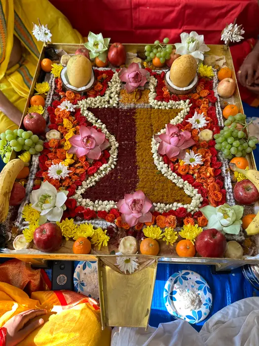 An elaborate floral puja offering with lotus and jasmine