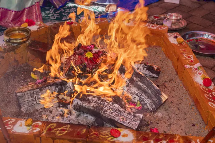 Flames rising from a homam fire